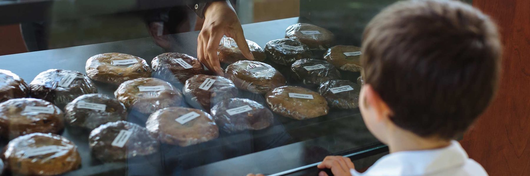 Young patron eyeing the sweet treats at concessions