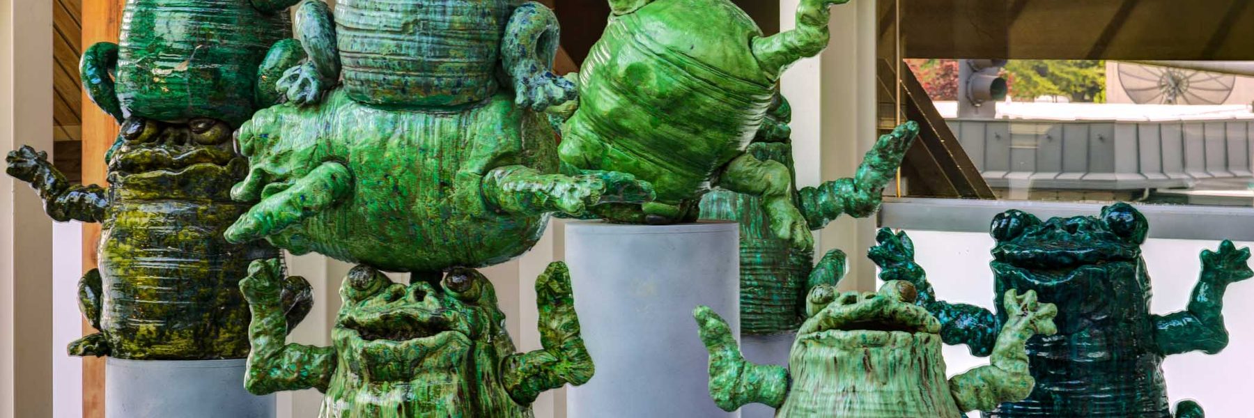 Ceramic green statues of frogs from the Hult Center Lobby