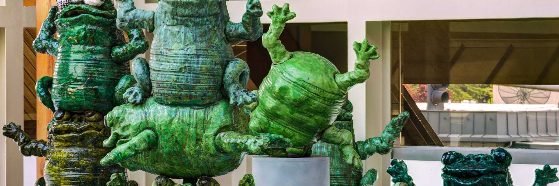 Ceramic green statues of frogs from the Hult Center Lobby