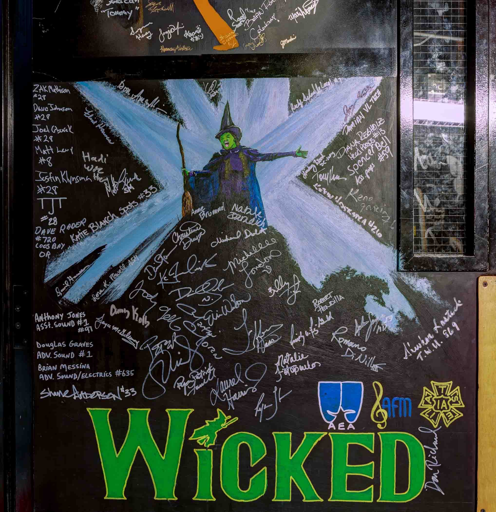 Backstage doors signed by past performers and companies