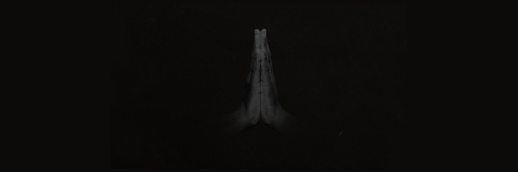 Image of two hands touching