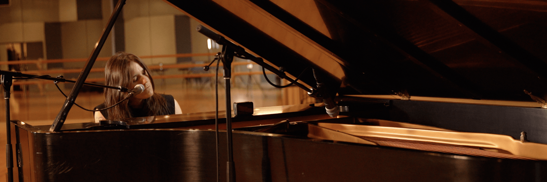 Image of Emily Wells playing piano