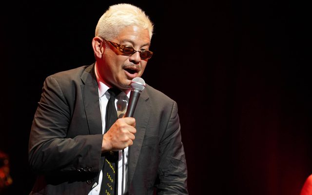 Man talking into a microphone