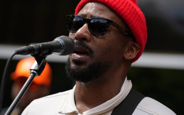 An individual singing into a microphone