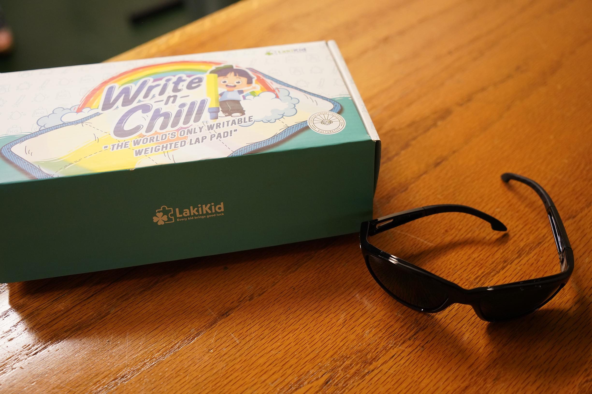 A box with WRITE N CHILL written on it and a pair of sunglasses