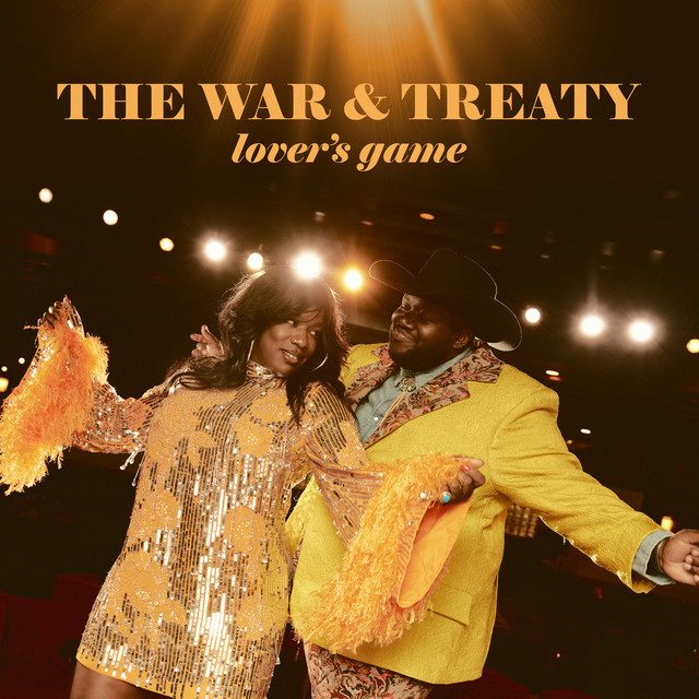 A picture of a man and woman in yellow attire posed in front of spotlights with text THE WAR & TREATY lover's game above them
