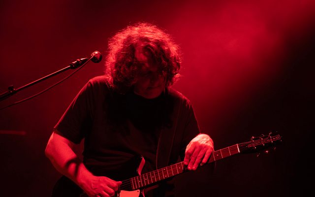 Guitar player in red light