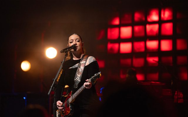 Ashley McBryde playing guitar